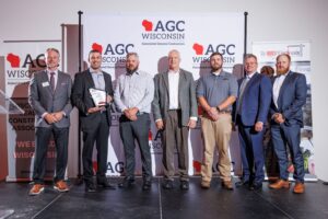 Faith Technologies team receives the AGC 2023 BUILD Wisconsin award. Pictured left to right: Bob Barker, executive vice president of Associated General Contractors of Wisconsin, Joe Jungbauer, senior project manager at Faith Technologies, Chris Roll, licensed superintendent at Faith Technologies, Bob Hougard Jr., vice president of science and technology at Findorff, Mitch Vree, licensed superintendent at Faith Technologies, Rob Walla, senior electrical engineer at Faith Technologies and Kurt Campbell, associate project manager at Faith Technologies. Photo courtesy Faith Technologies.