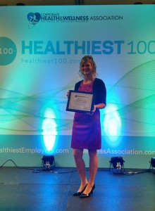 Alyssa Kwasny Accepting Healthiest 100 Workplaces Award
